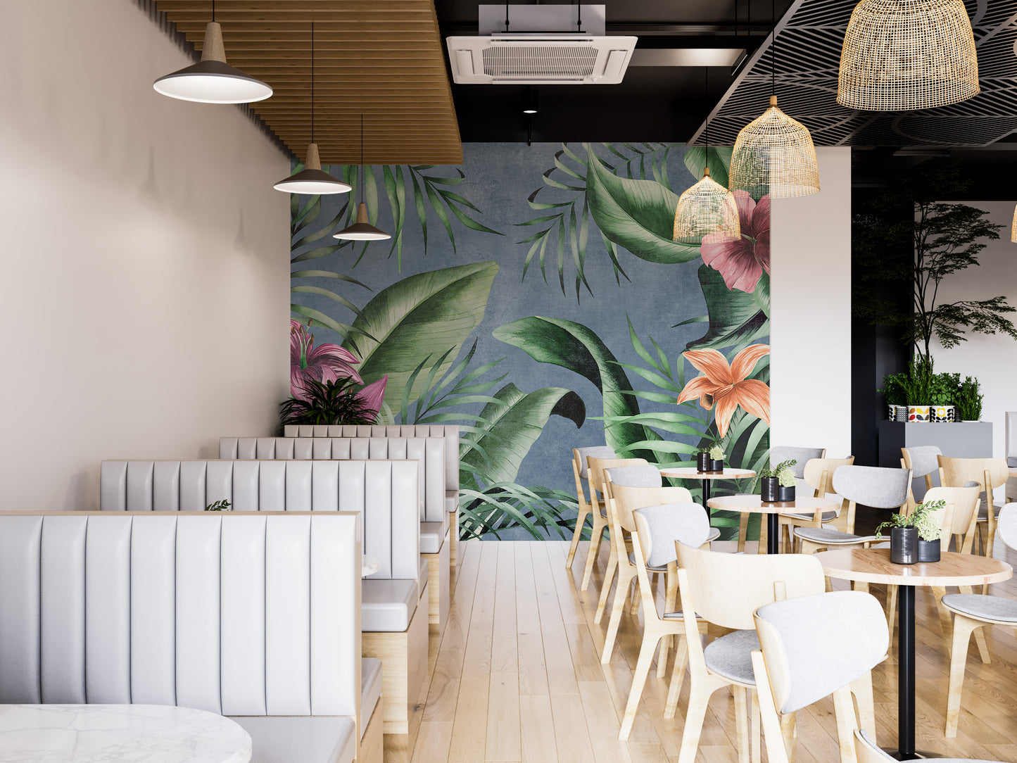 Tropical-inspired mural with green leaves on a rich blue background.