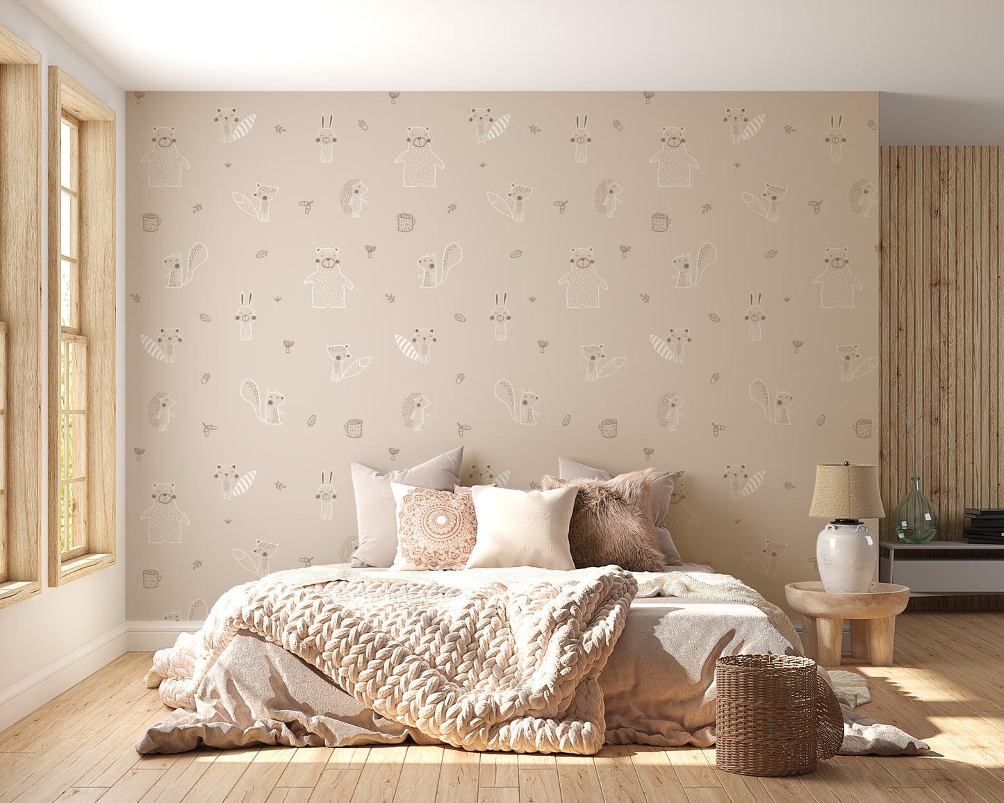 Beige Baby Forest Friends wallpaper with line-drawn bears foxes and rabbits behind a knit-bedded bed in a bedroom