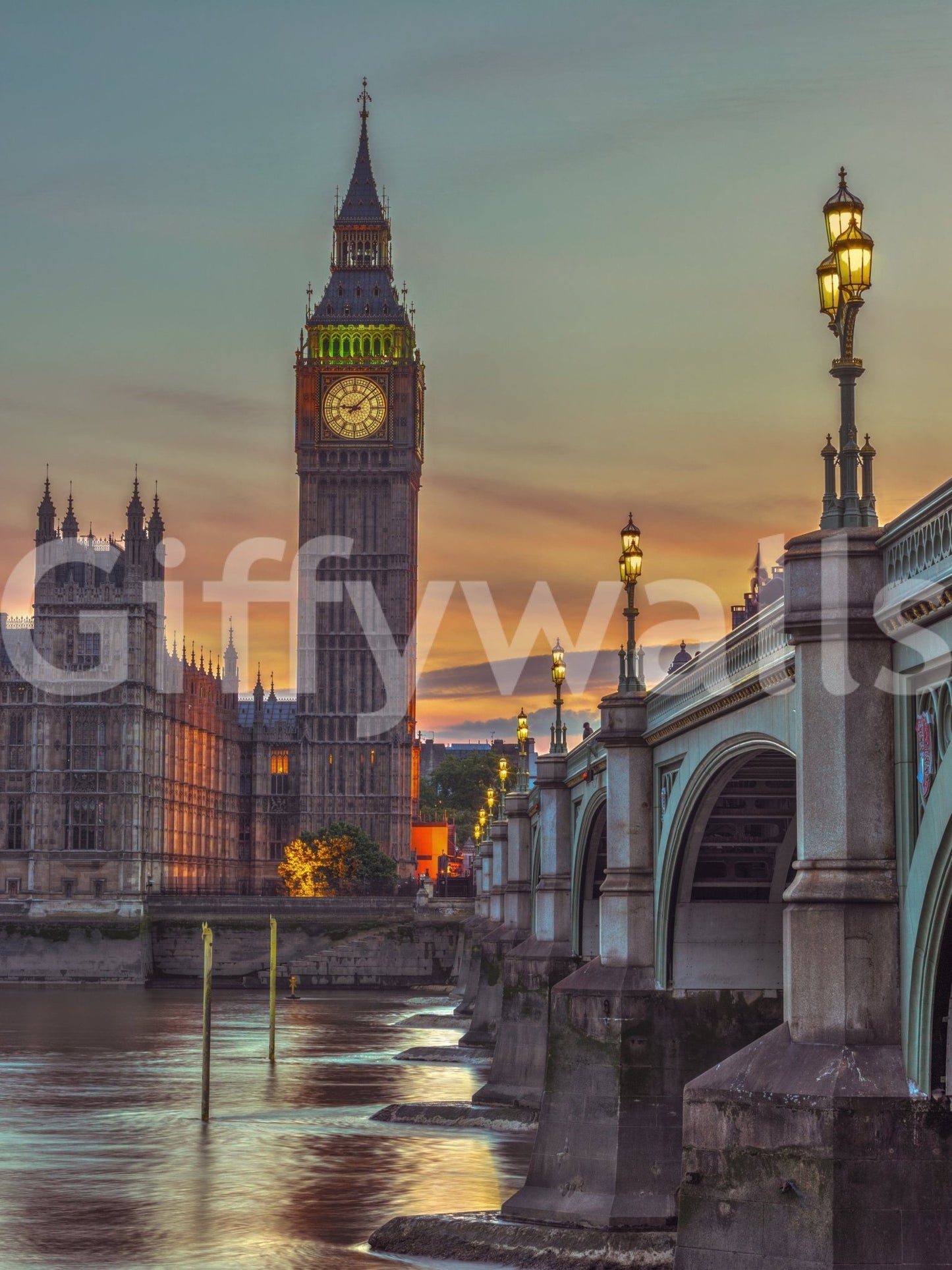 Clock tower wallpaper mural shown full-wall, Big Ben and Westminster Bridge over the Thames at sunset