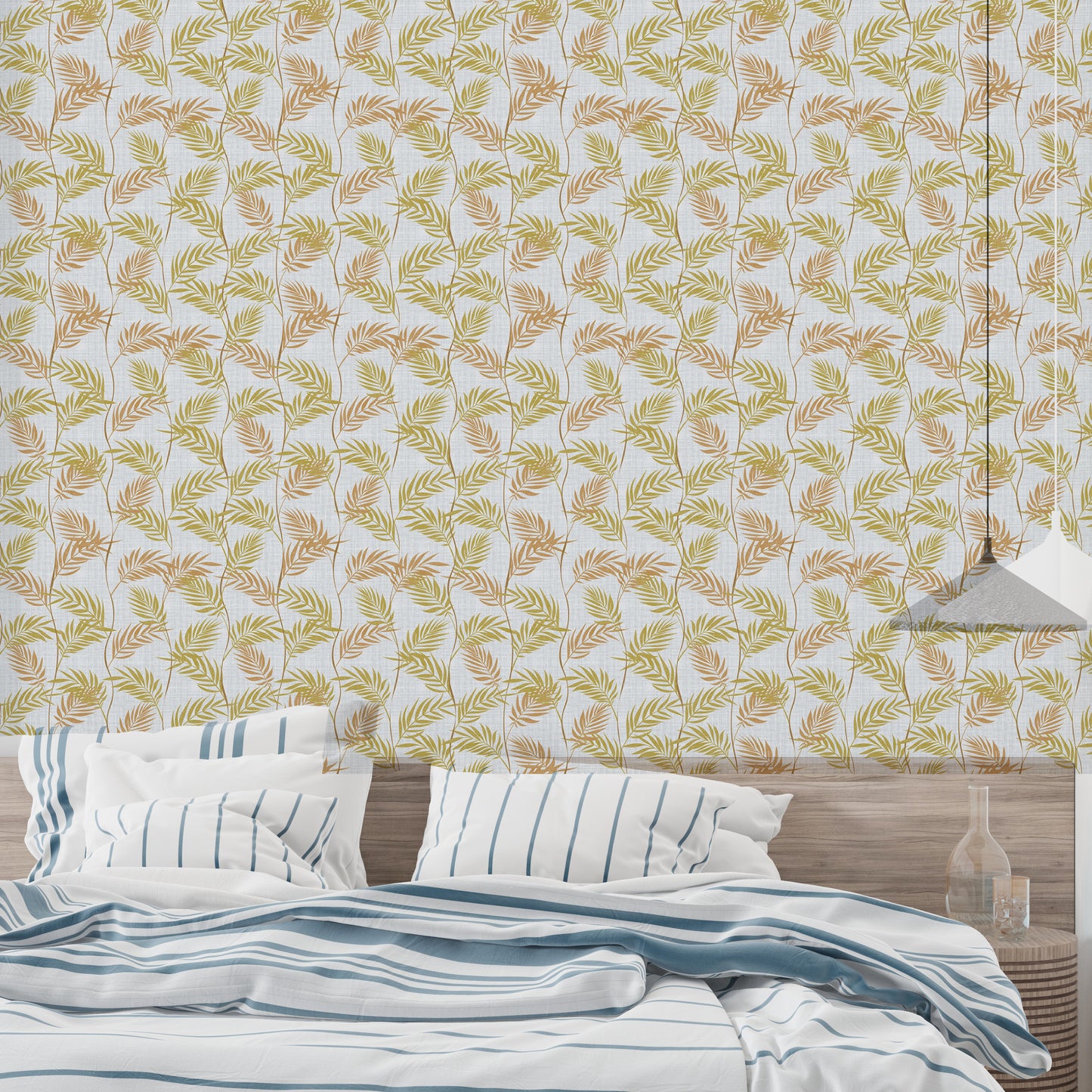 Elegant Palm Leaves wallpaper behind a bed dressed in blue striped bedding under a pendant light