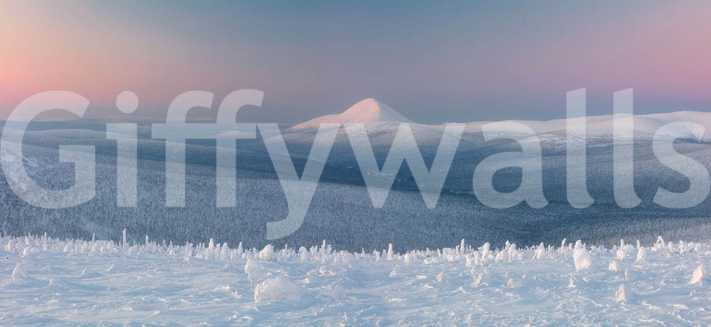 Icy Mountain Dreams wallpaper mural shown as a full-wall view of a snowy peak above a frosted valley at dusk