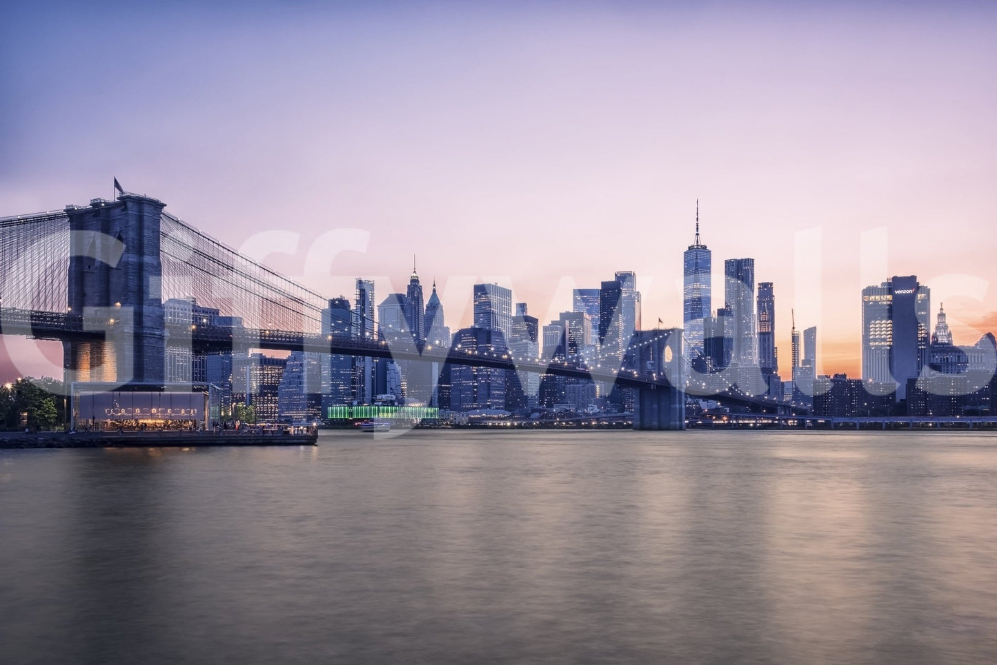 NYC Bridge at Dusk wallpaper mural shown as a full-wall view of the Brooklyn Bridge and skyline under a pink twilight sky