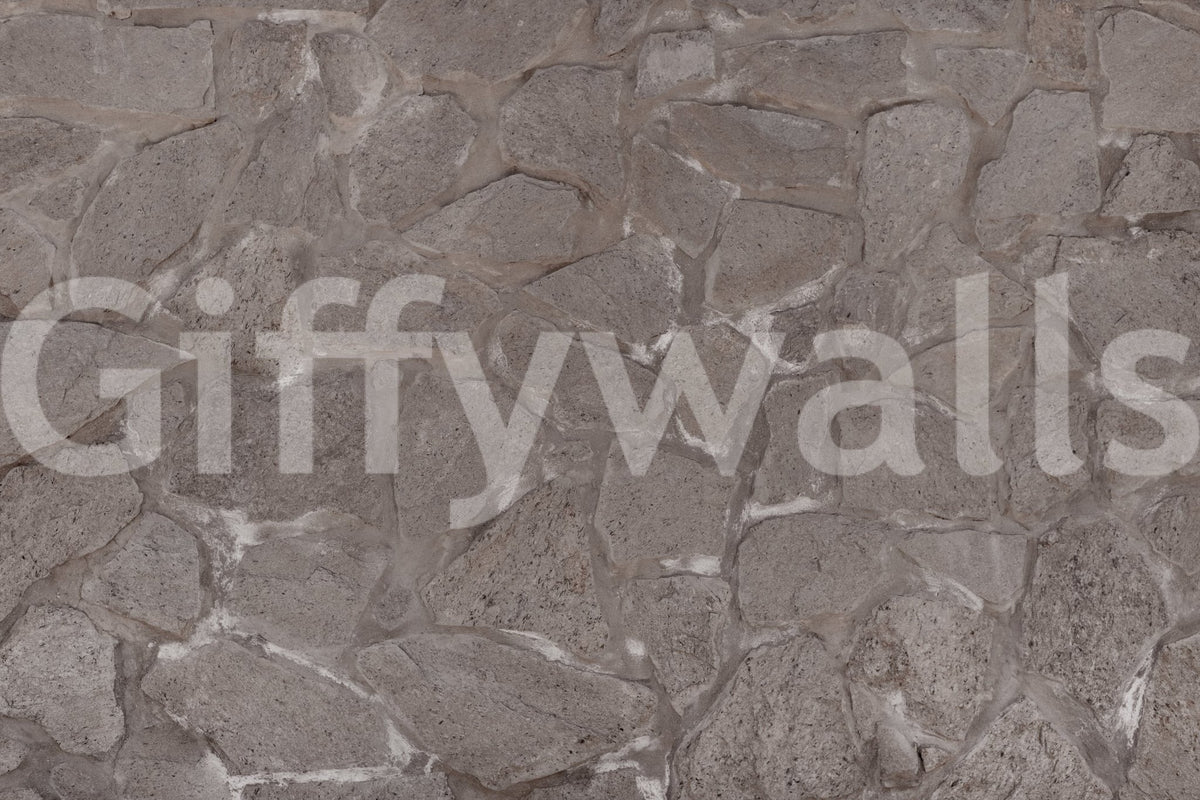 Rustic Stone wall mural close-up showing the pattern detail of irregular grey fieldstones with pale mortar