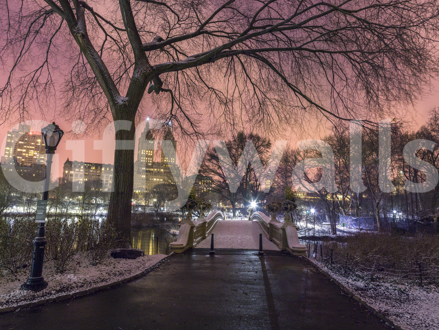 Drifting snow lines the railings in this Central Park Winter Twilight wall mural view.