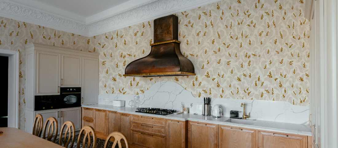 Kitchen wallpaper ideas 2026: a luxury kitchen with gold floral wall coverings.