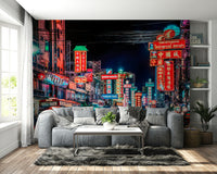 Busy Bangkok road with lit-up buildings

