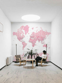 Feminine world map wall décor in pastel pink

