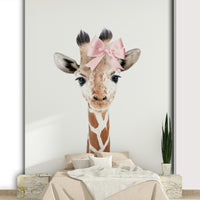 Baby giraffe with polka dot bow wallpaper for girls' rooms.