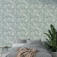 Baby blue wallpaper with flowing plant pattern

