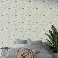 Minimal woodland wallpaper in muted green tones

