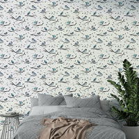 Artistic robin and branch wallpaper in aqua hues


