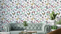 Flying butterflies wallpaper in green and pink pastels


