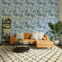 Tropical forest wallpaper with blue leaf accents

