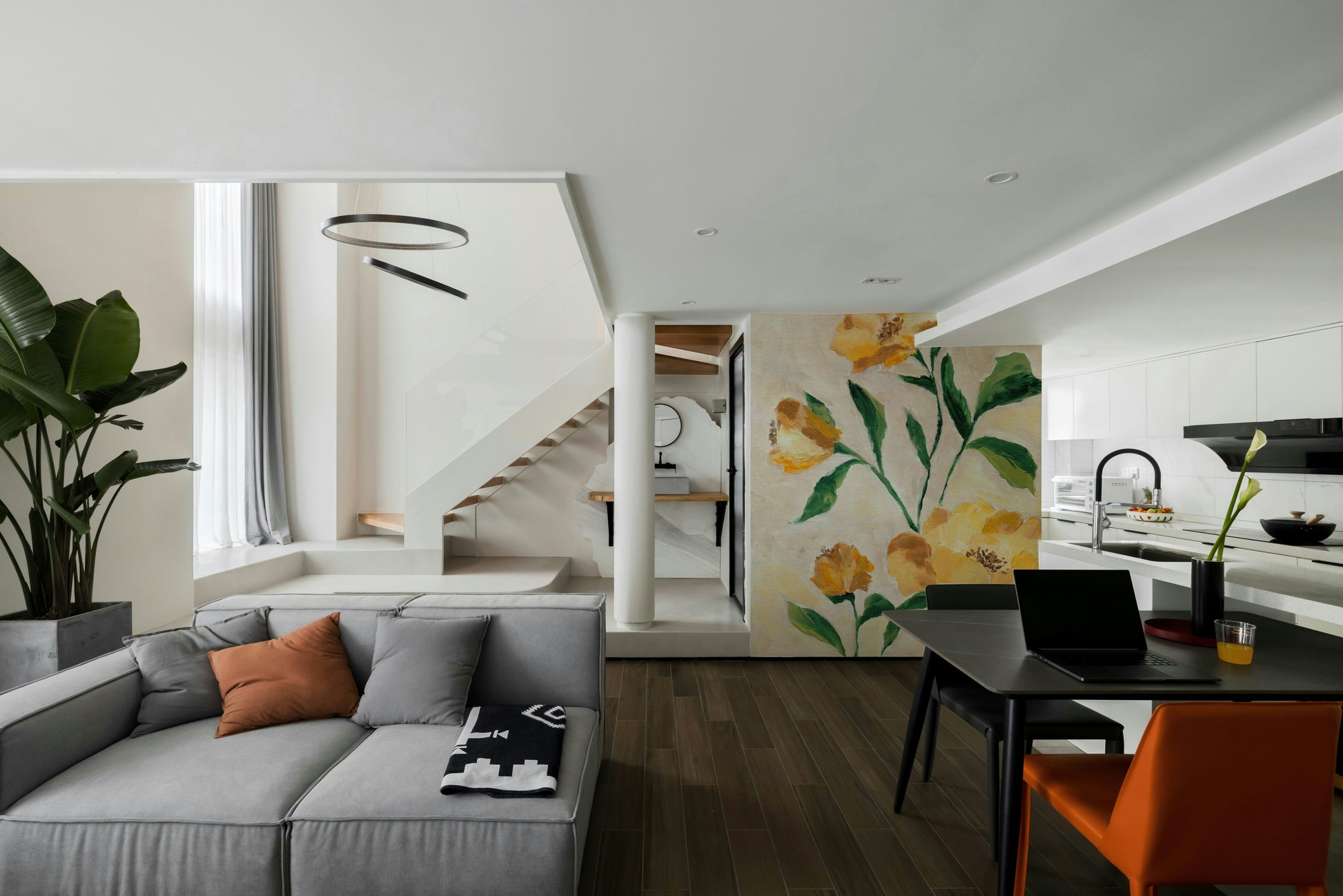 Botanical wall mural with soft golden flower tones

