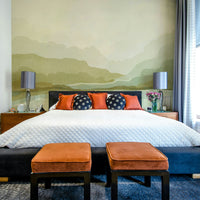 Large-scale mural of misty mountains and valleys

