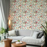 Nature-inspired owl wallpaper with green and red foliage

