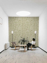 Minimal leafy wallpaper in muted sage green

