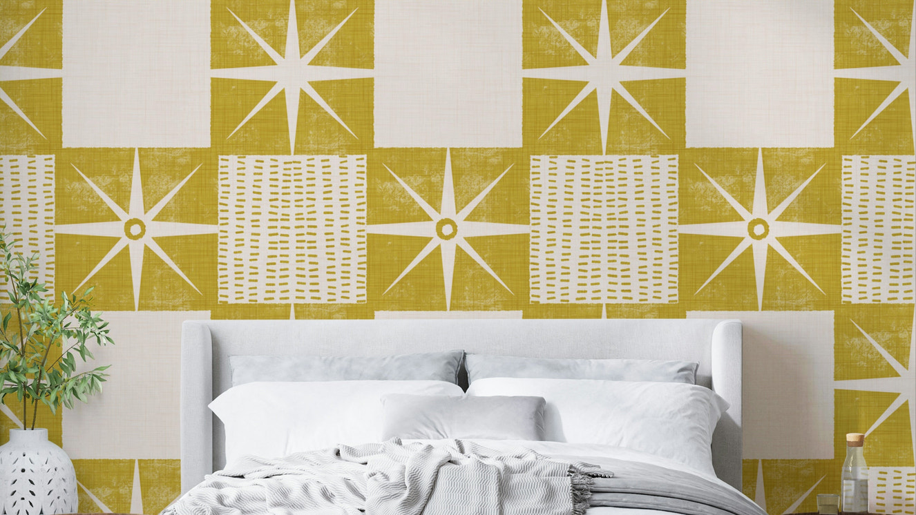 Retro starburst quilt block wallpaper in mustard yellow

