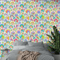 Wallpaper with playful rainbow curves in bold pink, blue, and yellow.

