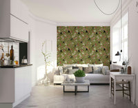 Subtle jungle mural with botanical elements on a soft, neutral background.

