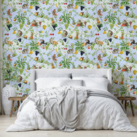 Vibrant jungle wallpaper with monkeys and colorful flora.

