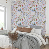 Lush botanical wallpaper featuring vines, blooms, and foliage.

