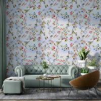 Vibrant wall mural with painted flowers and chirping birds.

