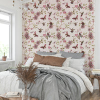 Pastel floral wallpaper featuring butterflies and green foliage.

