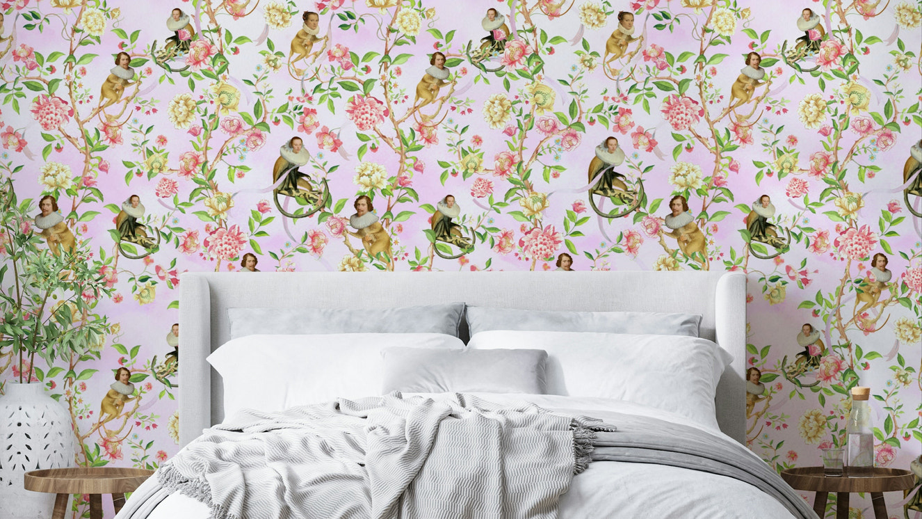 Playful wallpaper featuring monkeys in hats surrounded by blooms.

