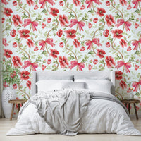 Wallpaper with watercolor florals and decorative ribbon accents.

