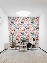 Close-up of pink roses and leaves on a blue and white striped base.

