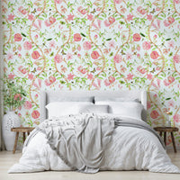 Peach floral wallpaper with green leaves and perched songbirds.

