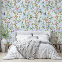 Elegant mural featuring chinoiserie-style blooms in watercolor tones.

