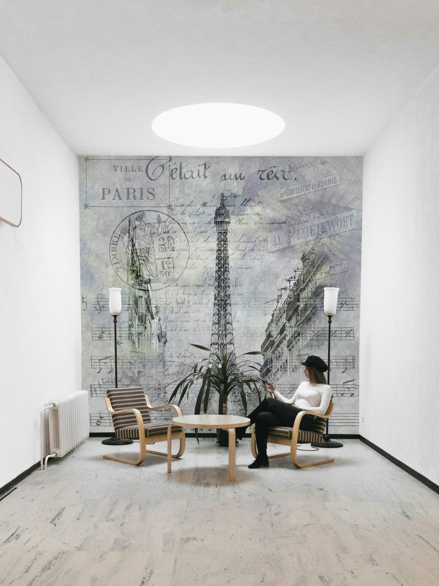 Collage-style mural of Paris architecture and tower


