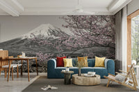 Black-and-white mural with pink cherry blossom highlights

