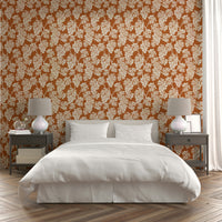 Grapevine design wallpaper with warm terracotta shades.

