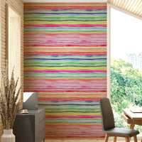 Lively, vibrant striped wallpaper for a cheerful summer-inspired room.

