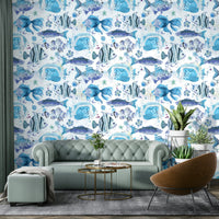 Wallpaper with hand-painted tropical fish swimming through blue waters.

