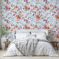 Sophisticated wallpaper with blue and red roses on a white backdrop.

