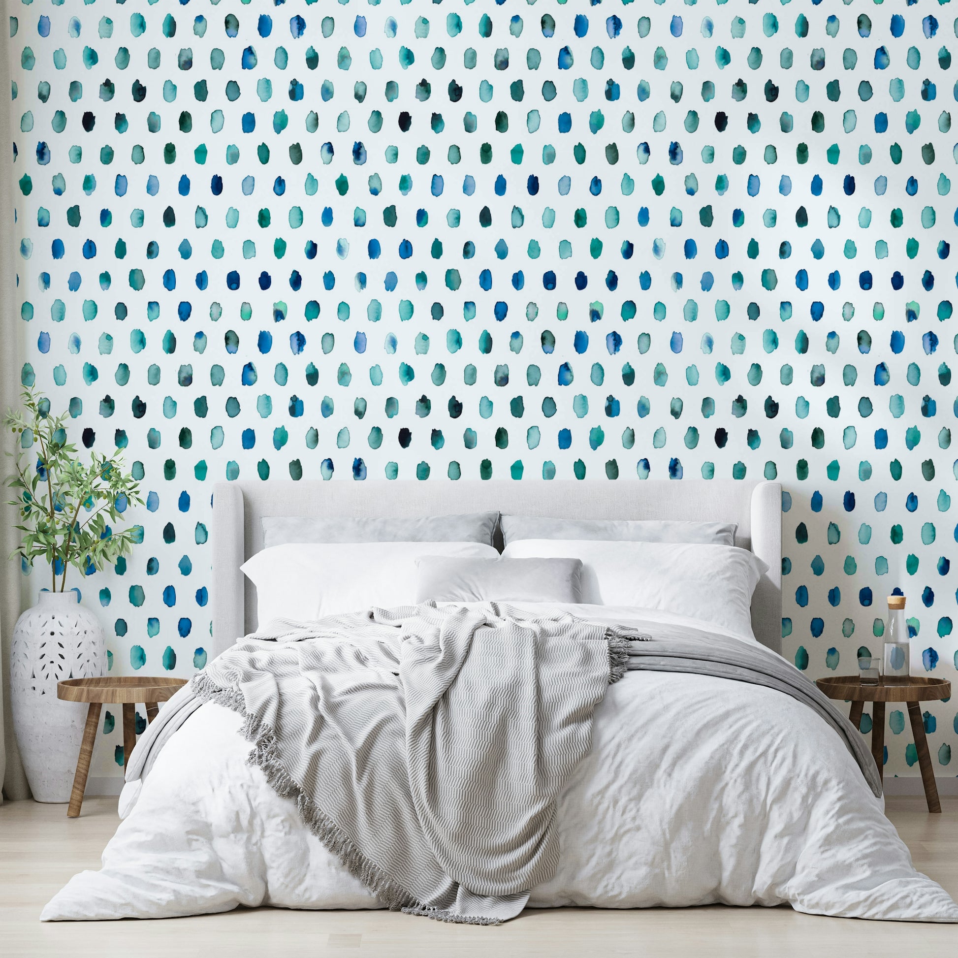 Playful blue watercolor dots on a clean, neutral backdrop.

