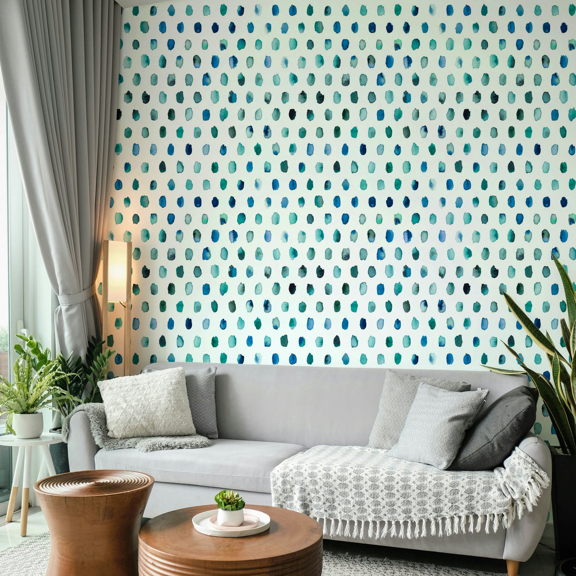 Abstract wallpaper featuring blue watercolor dots on white background.

