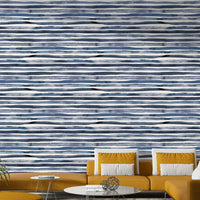 Light blue and white striped wallpaper with a painterly effect.


