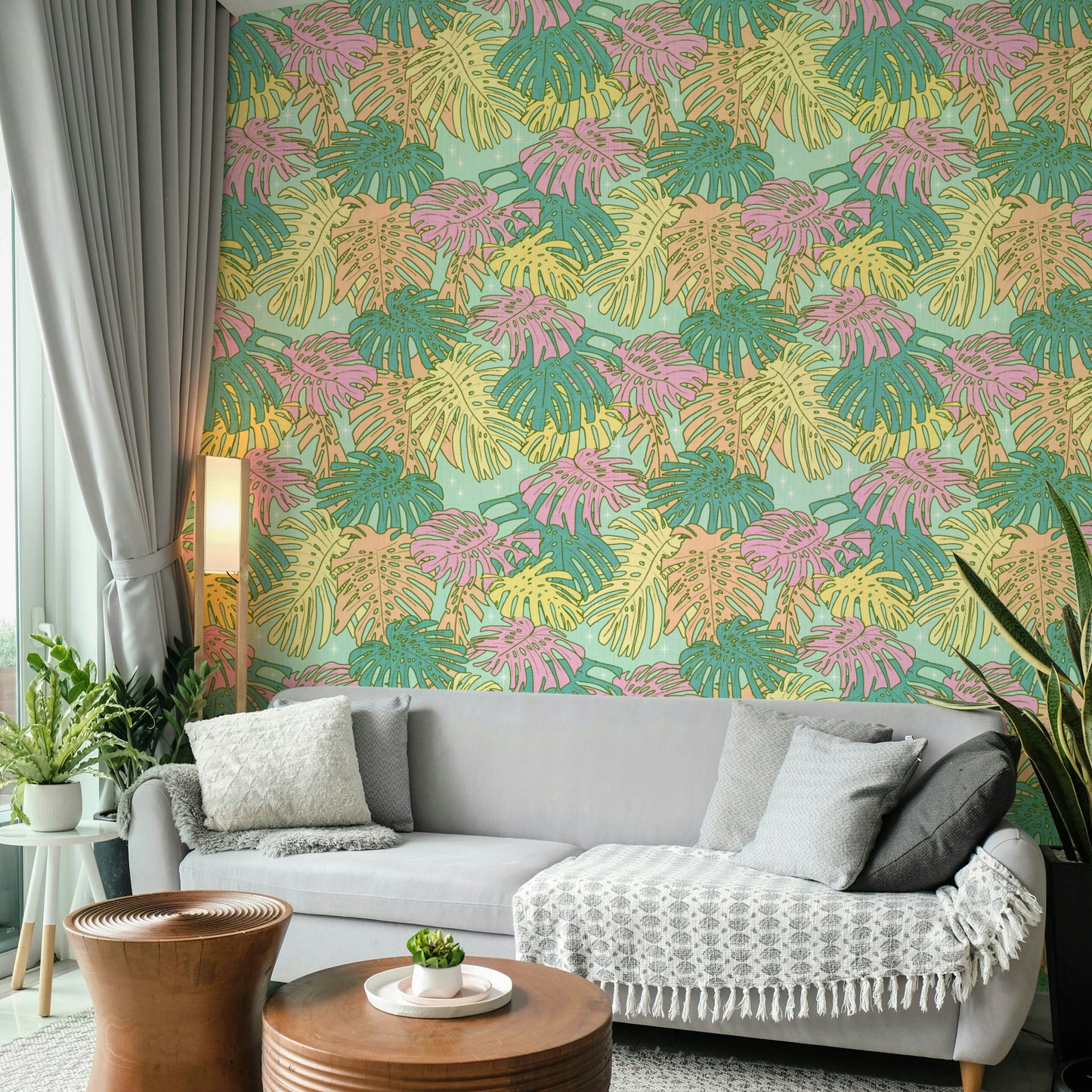 Wallpaper design with pastel tropical foliage and aqua blue accents.

