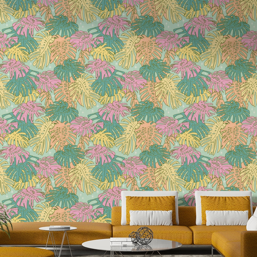 Wallpaper with pastel aqua tones and vintage tropical Monstera foliage.

