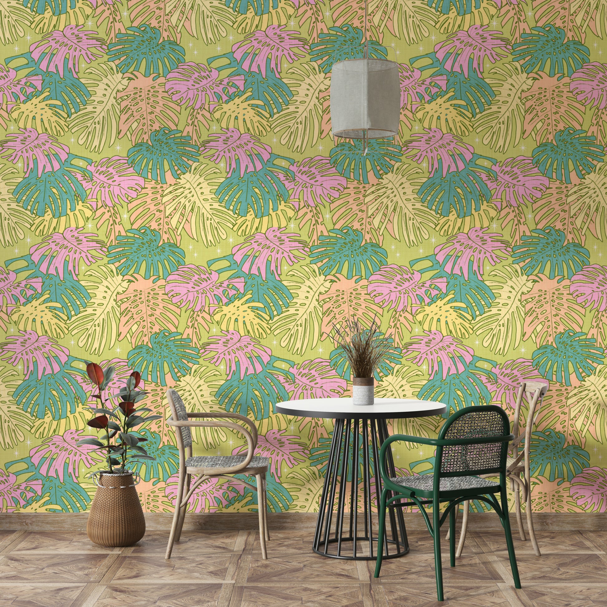 Tropical leaf design in pastel avocado green, pink, and beige on wallpaper.

