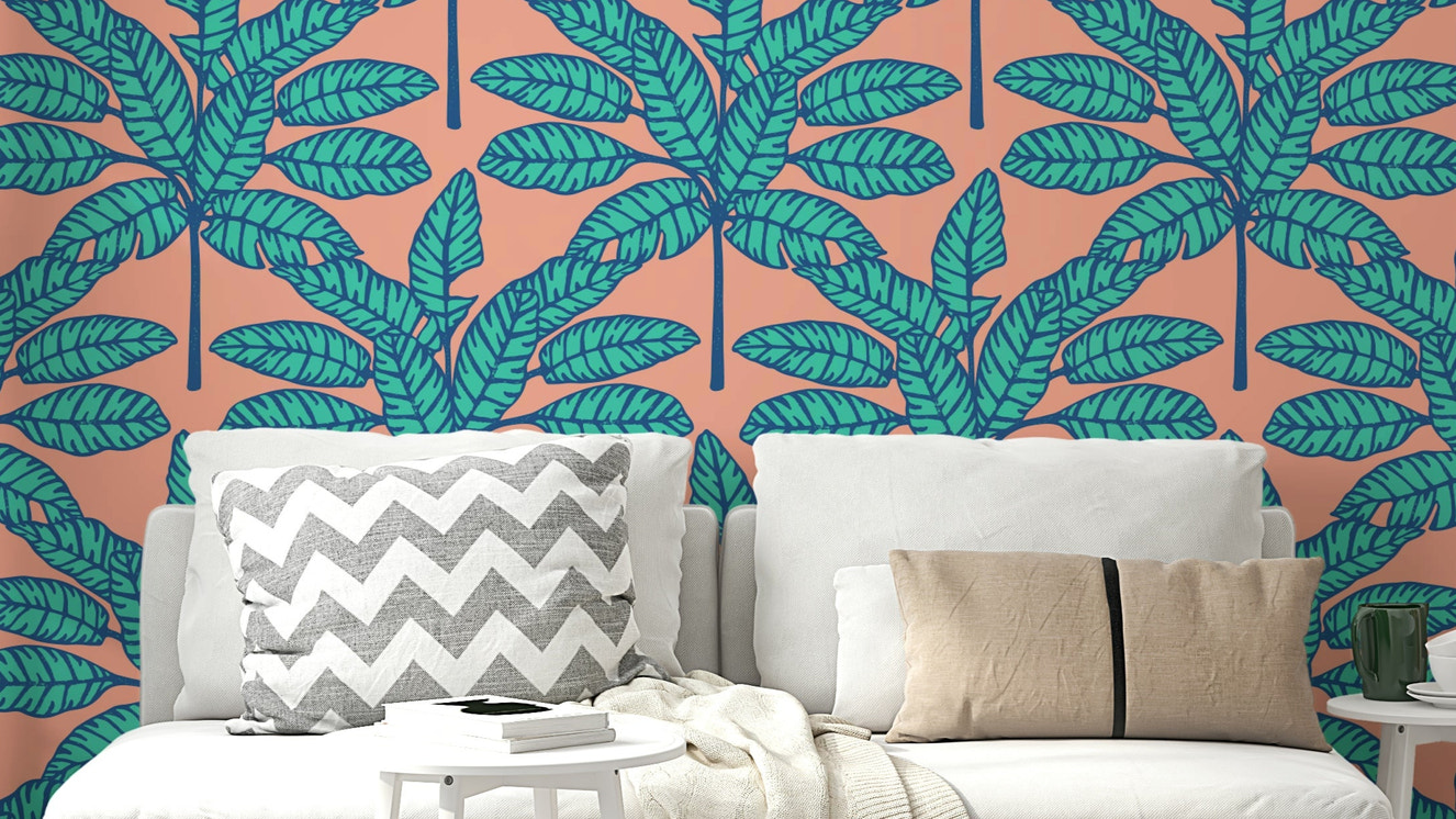 Tropical oasis wallpaper featuring desert leaves in soothing blue and soft pink.


