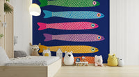 Anchovies fish in vibrant hues on a royal blue wall mural.


