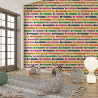 Whimsical fish wallpaper with rainbow colors set on a cream canvas.

