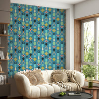 Mid-century modern wallpaper with playful geometric forms on blue.

