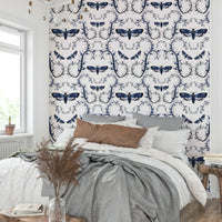 Mural wallpaper of moths and botanical swirls

